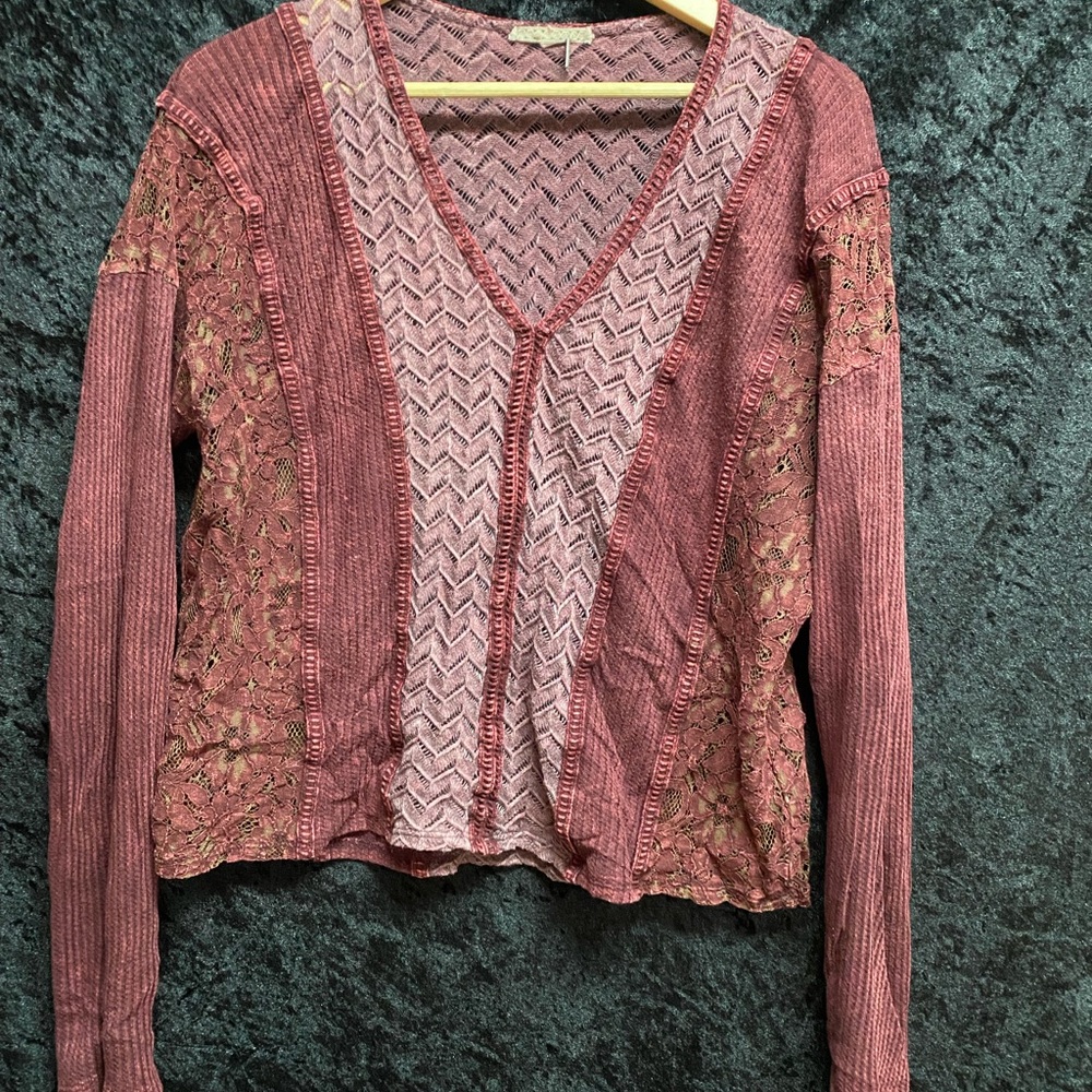 Deep red long sleeve top.